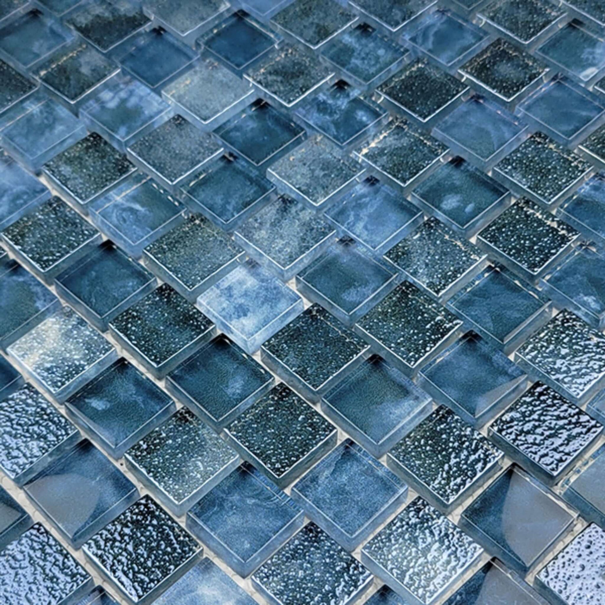 Artistry in Mosaics 1x1 Glass Tiles Gunmetal Blue SS82323B8 from Discount Pool Mart DPM, showcasing a modern tile layout.
