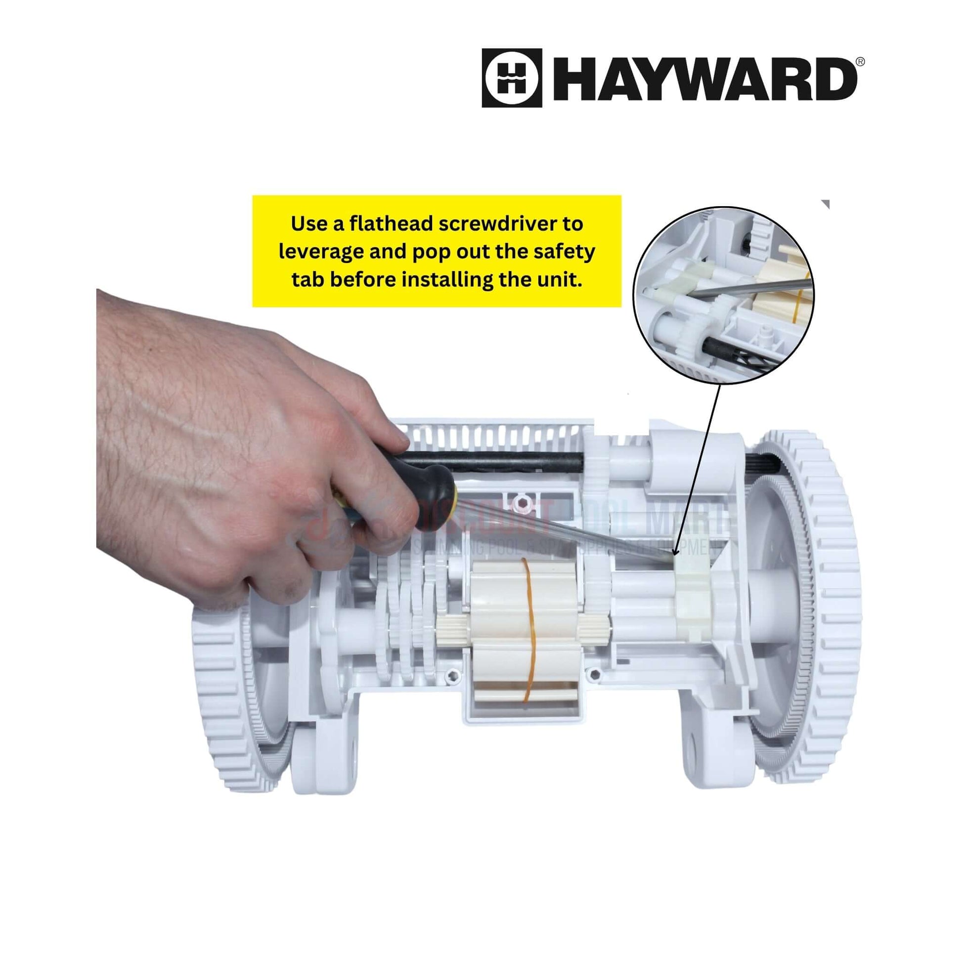 Using a flathead screwdriver to pop the safety tab on Hayward Poolvergnuegen cleaner for repairs at Discount Pool Mart DPM.