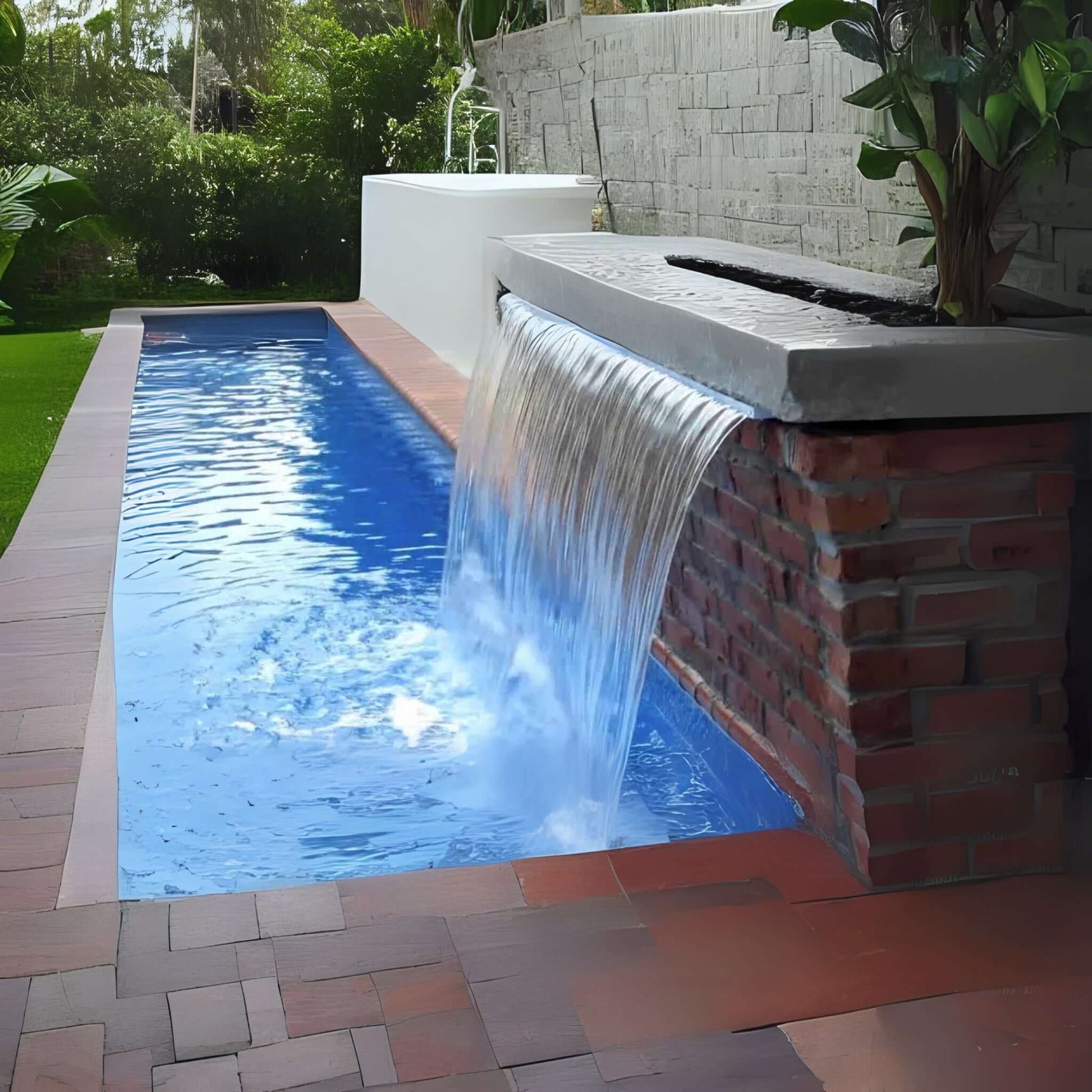 CMP Natural Wonders 72" x 6" Lip White Waterfall 25577-630-000 cascading into sparkling blue pool, enhancing outdoor beauty.