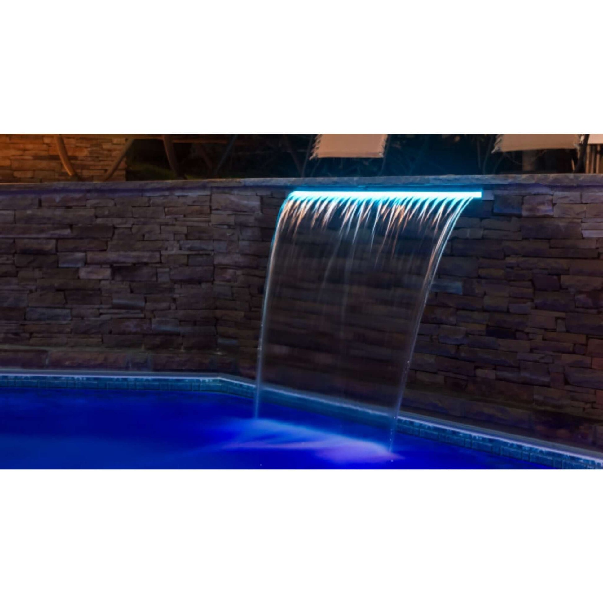 25677-330-000 | CMP Brilliant Wonders 36" LED Waterfall with blue LED lighting cascading into swimming pool at night.