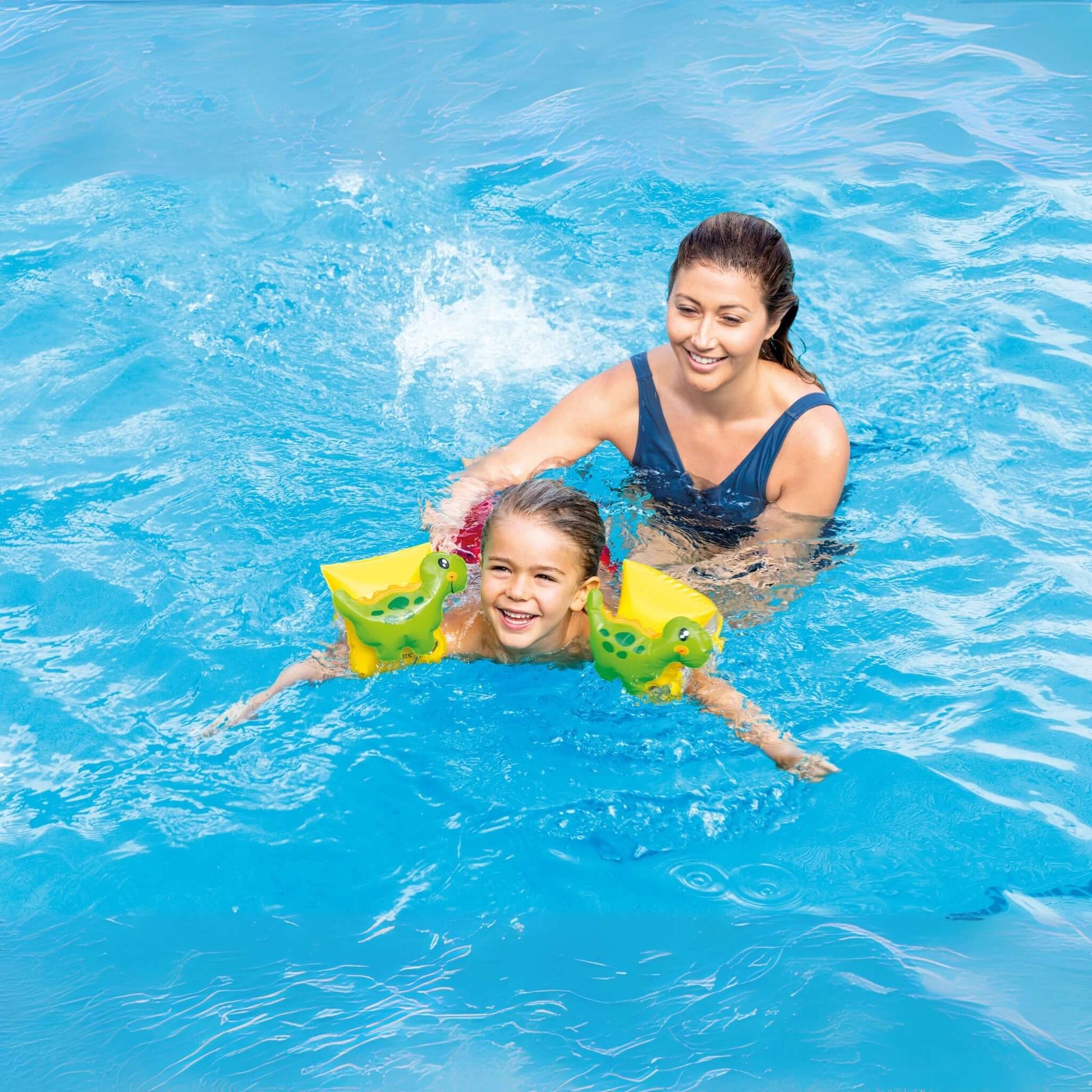 Child in Dinosaur Arm Bands swimming with parent in pool, vibrant colors for safety and fun. Intex 32132J from Discount Pool Mart DPM.