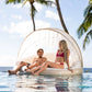 Couple relaxing on INTEX Canopy Island Inflatable Pool Float, SKU 58292EP, from Discount Pool Mart DPM. Resort-style lounging.