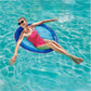 Woman relaxing on SwimWays Premium Spring Float Papasan in blue water, enjoying summer comfort. SKU 6069494. Discount Pool Mart DPM.