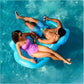Couple relaxing on SwimWays Premium Spring Float Duo in the pool, SKU 6071270, from Discount Pool Mart (DPM).