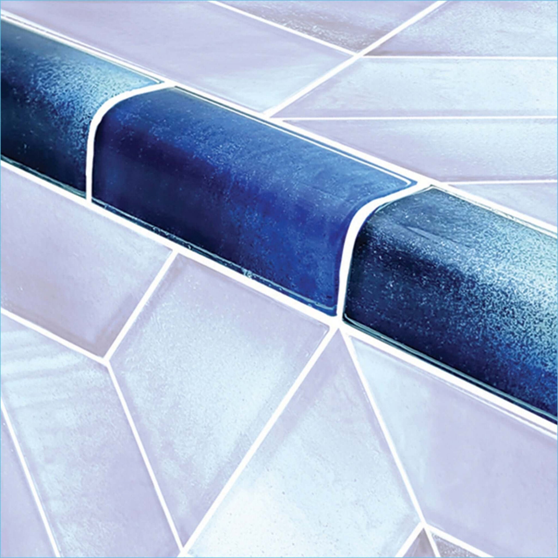 Artistry in Mosaics Cirrus Blue Trim 2" x 4" glass tiles on pool waterline by Discount Pool Mart DPM. SKU: TRIM-TZ824B2.