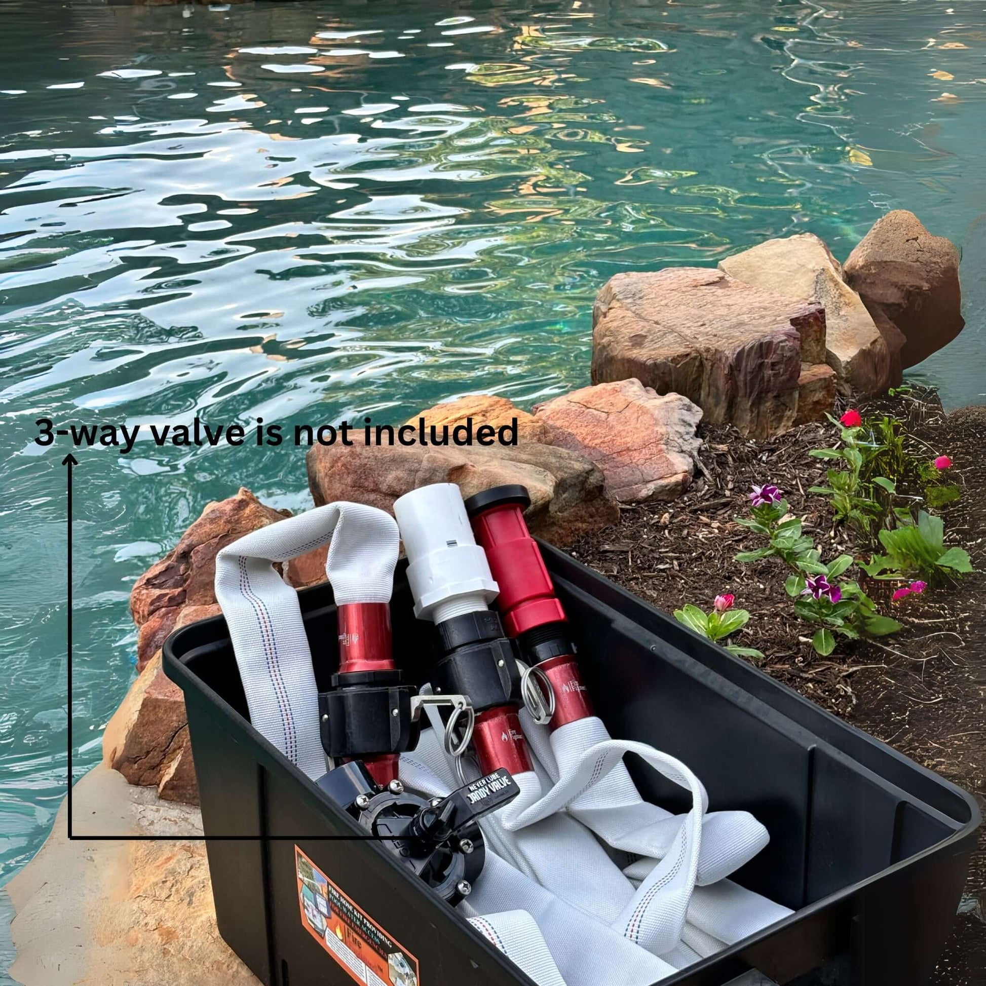 FireFighter1 fire hose for pool pump shown in storage box by water, with 3-way valve note, from Discount Pool Mart DPM.