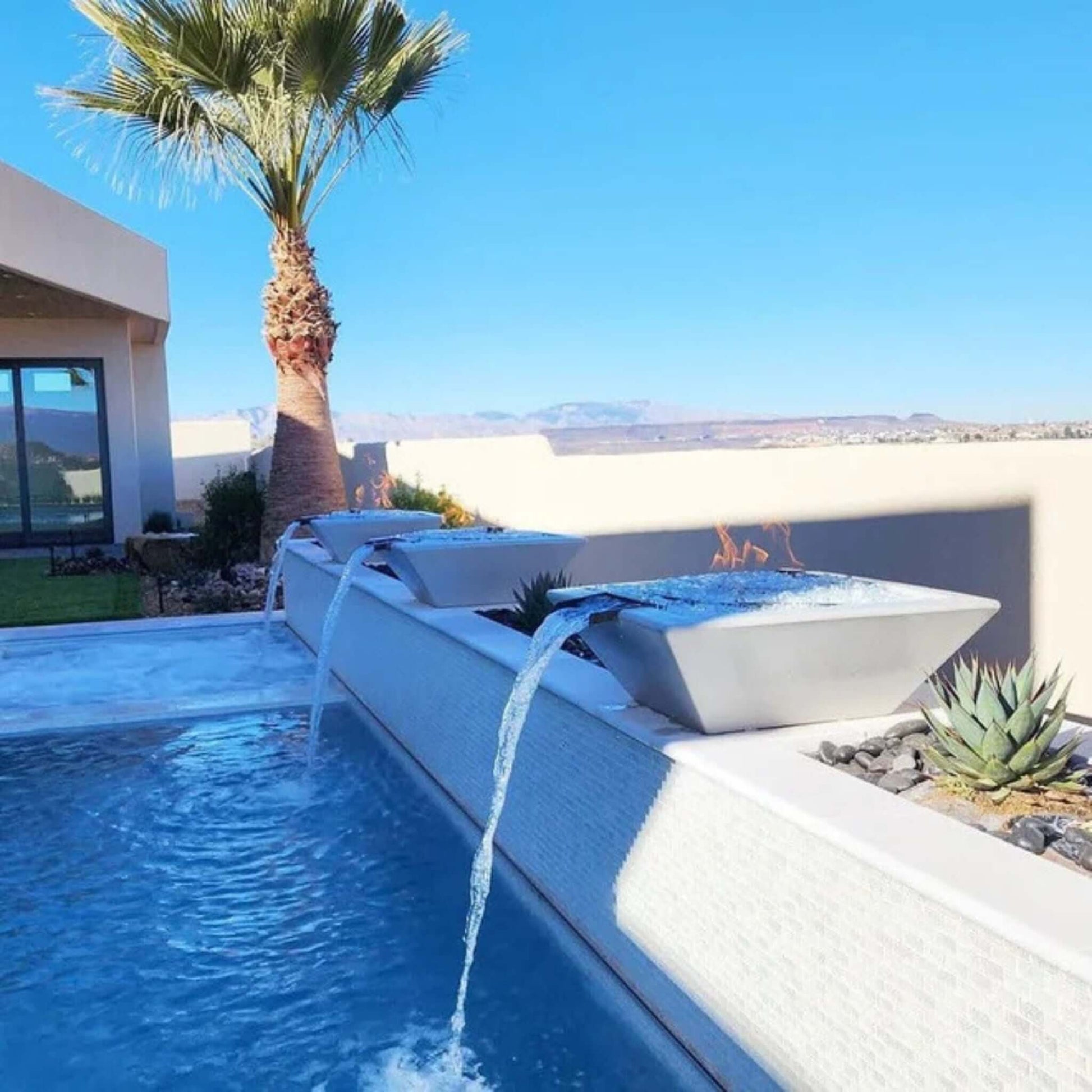 Grand Effects Corinthian Fire & Water Bowl Concrete in tranquil pool setting by Discount Pool Mart DPM.