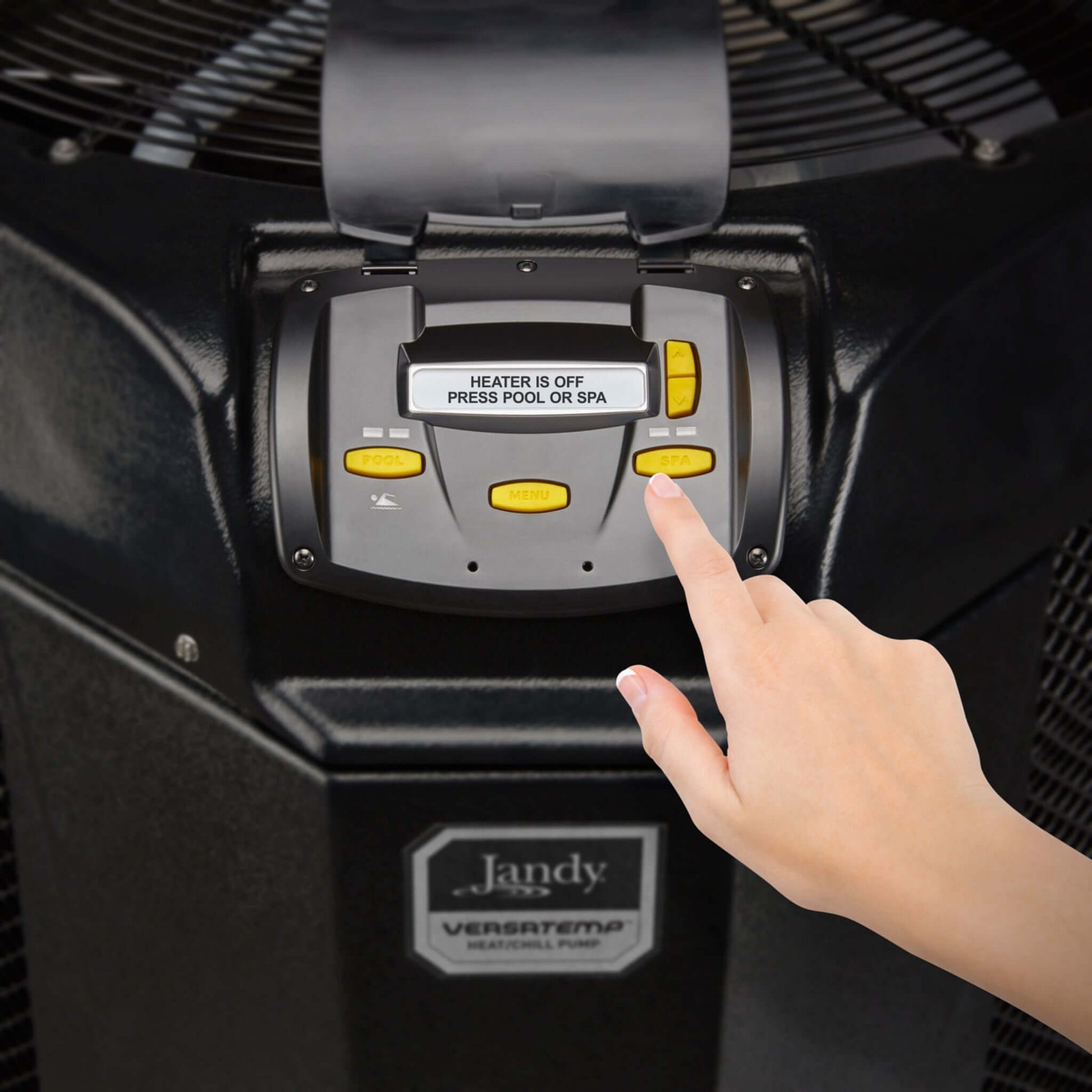 Jandy VersaTemp JRT3000R control panel with hand pressing buttons for heater settings, showcasing pool and spa temperature management.