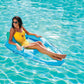 SwimWays Premium Spring Float Recliner SKU 6069119 in use at Discount Pool Mart DPM, woman relaxing in pool.