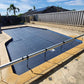 EnergyGuard™ solar cover custom-cut to fit pool steps for full surface protection.