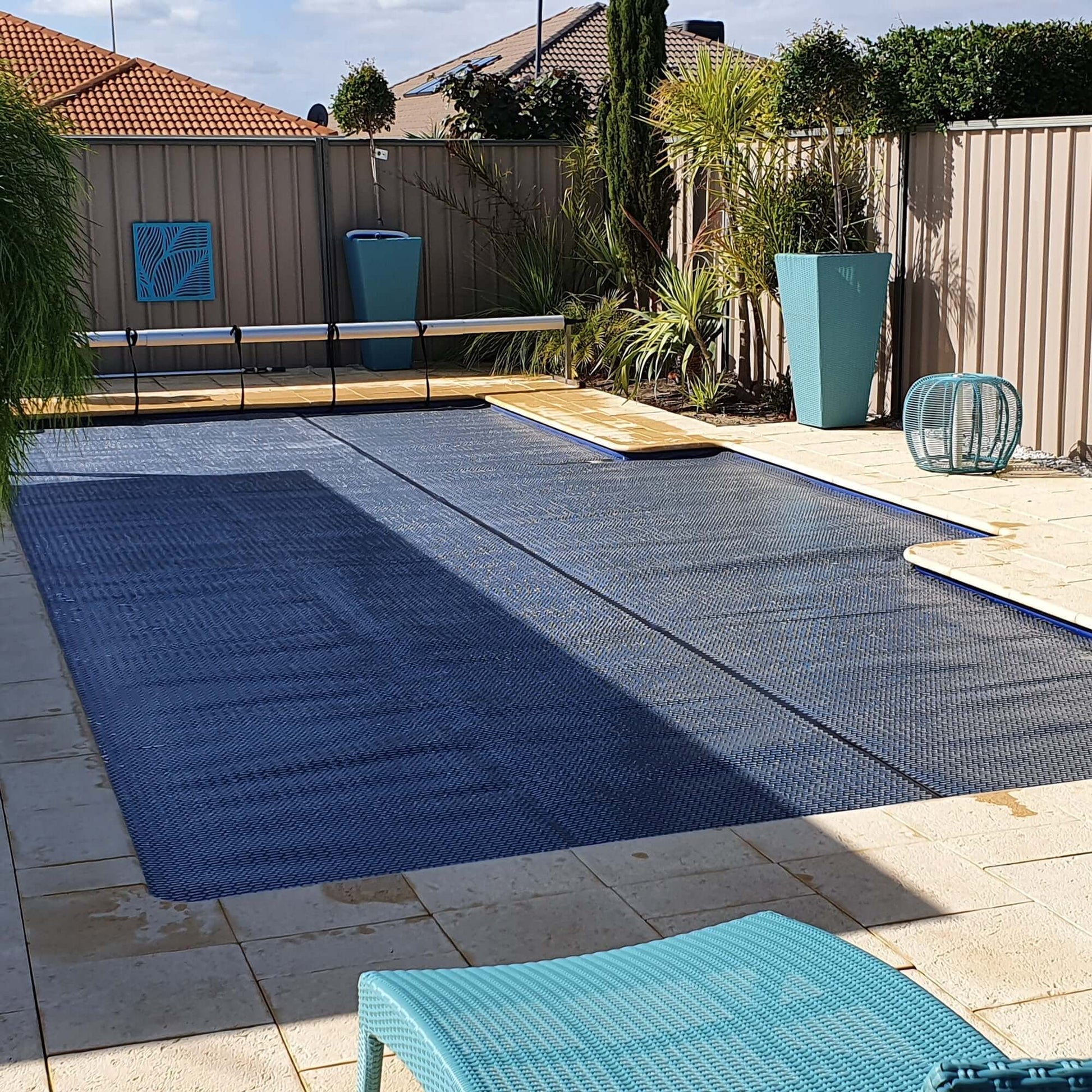 Detailed shot of GeoBubble™ cover bubbles and surface material on an installed pool cover.