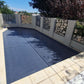 Close-up showing the EnergyGuard™ solar pool cover sealed over a residential pool.